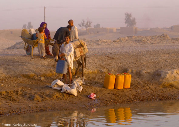 Baloch kids drawing water from Helmand River